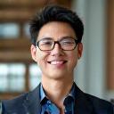 Portrait of Marcus Chen, a thoughtful and analytical man with a gentle expression.